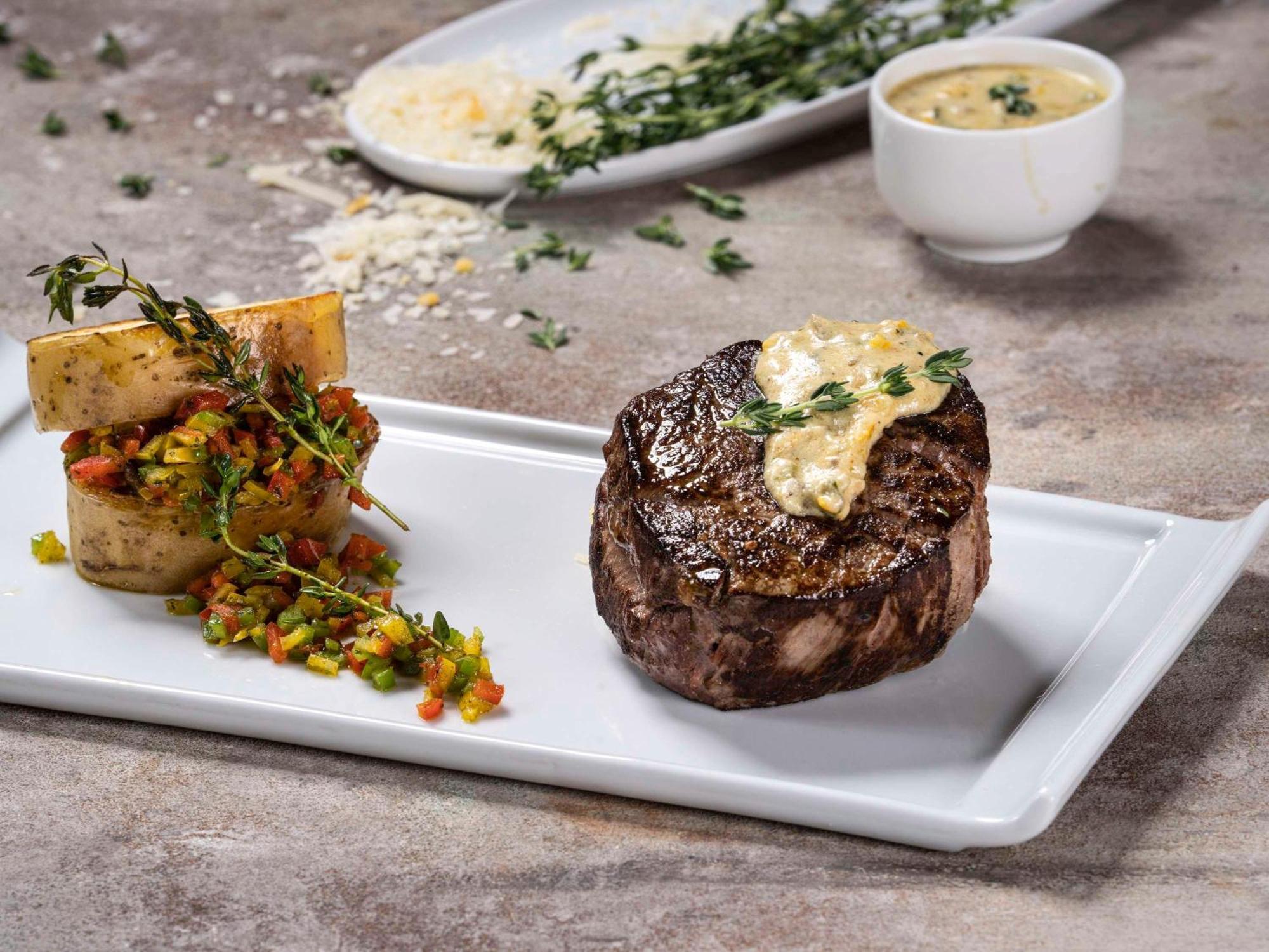 Movenpick Hotel And Residences Ер-Ріяд Екстер'єр фото A steak prepared with a butter sauce